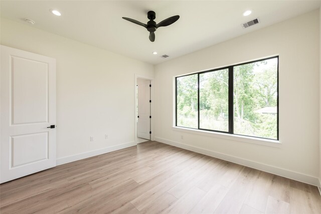 6137 Pacific Forest Dr, Houston, TX 77346 - spare room featuring light wood-style floors, baseboards, ceiling fan, recessed lighting, and a smoke detector
