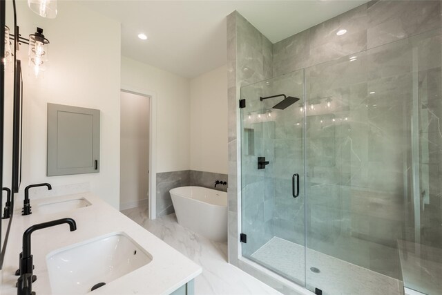 6137 Pacific Forest Dr, Houston, TX 77346 - bathroom with a stall shower, a soaking tub, double vanity, and recessed lighting
