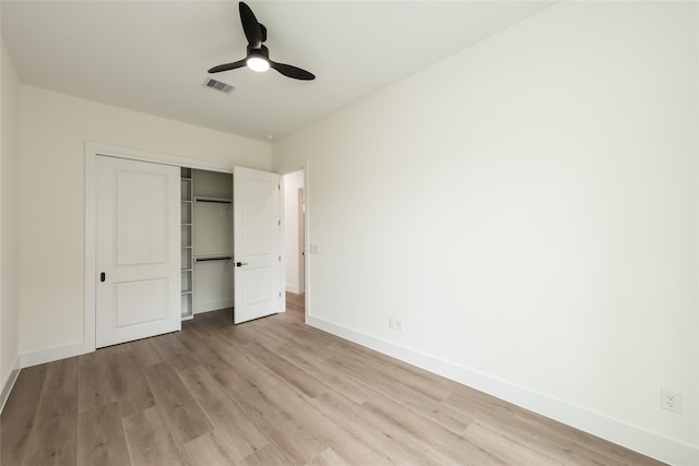 6137 Pacific Forest Dr, Houston, TX 77346 - unfurnished bedroom featuring light wood-type flooring, baseboards, a closet, and a ceiling fan