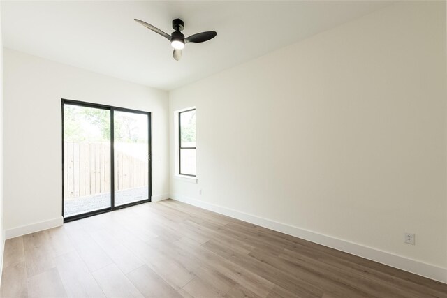 6137 Pacific Forest Dr, Houston, TX 77346 - spare room featuring light wood-type flooring, ceiling fan, and baseboards