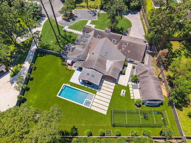 view of subject property with a pool area