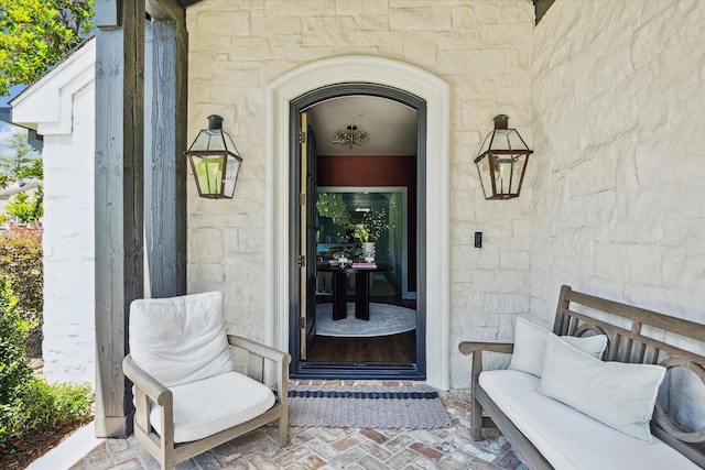 property entrance featuring stone siding