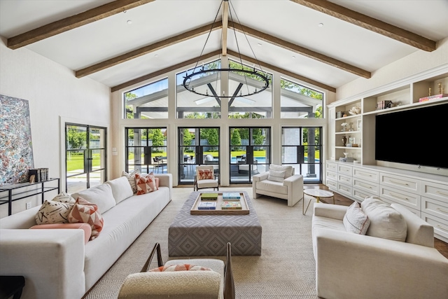 living room with beamed ceiling, healthy amount of natural light, and high vaulted ceiling