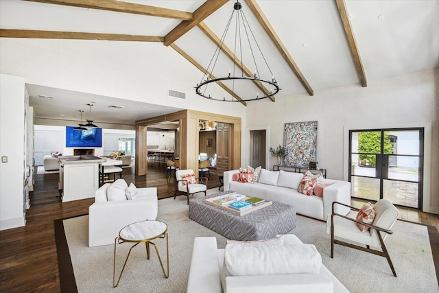 living room featuring high vaulted ceiling, dark wood-type flooring, a chandelier, plenty of natural light, and beamed ceiling