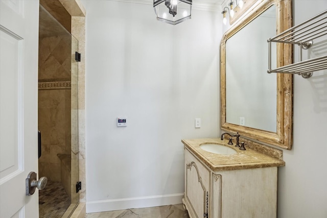 full bathroom with a shower stall, vanity, baseboards, and a chandelier