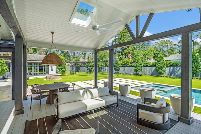 wooden deck with outdoor dining area, ceiling fan, and a pool with connected hot tub