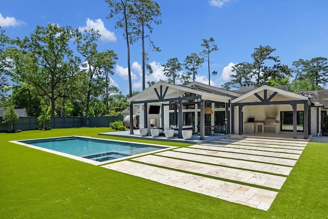 back of house with a patio and an in-ground hot tub