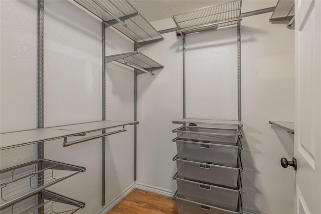 2240 Easley Cir, Huntsville, TX 77320 - walk in closet featuring wood finished floors