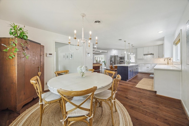 3006 Ann Arbor Dr, Houston, TX 77063 - dining room featuring dark wood-style floors, a chandelier, and recessed lighting