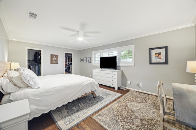 3006 Ann Arbor Dr, Houston, TX 77063 - bedroom with ornamental molding, wood finished floors, a walk in closet, baseboards, and a closet