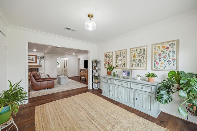 3006 Ann Arbor Dr, Houston, TX 77063 - sitting room with dark wood-style floors and ornamental molding