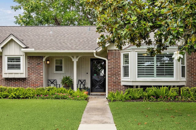 3006 Ann Arbor Dr, Houston, TX 77063 - ranch-style home with a shingled roof, a front yard, and brick siding