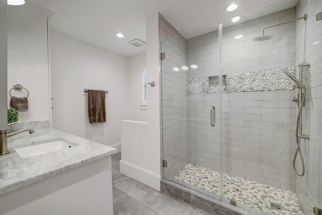 412 Merrill St, Houston, TX 77009 - bathroom with recessed lighting, a stall shower, baseboards, and vanity