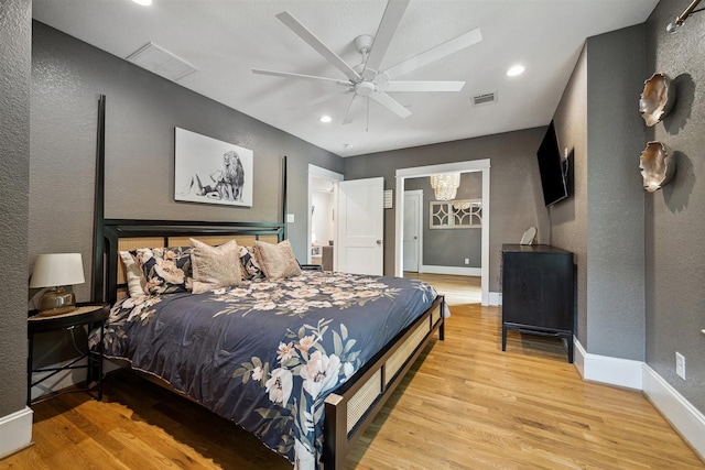 412 Merrill St, Houston, TX 77009 - bedroom featuring wood finished floors, a textured wall, baseboards, recessed lighting, and a ceiling fan