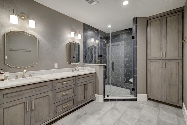 412 Merrill St, Houston, TX 77009 - full bathroom featuring a stall shower, double vanity, and recessed lighting