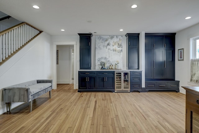 412 Merrill St, Houston, TX 77009 - indoor dry bar with wine cooler, light wood-style flooring, recessed lighting, and stairs