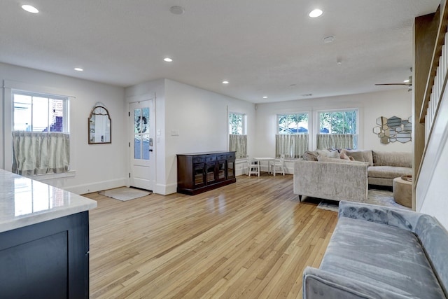412 Merrill St, Houston, TX 77009 - living area with light wood finished floors, recessed lighting, baseboards, and a ceiling fan