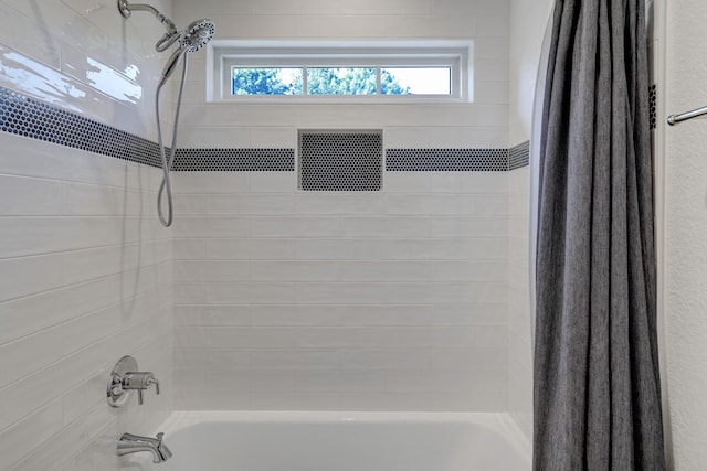 412 Merrill St, Houston, TX 77009 - full bathroom with plenty of natural light and shower / tub combo with curtain