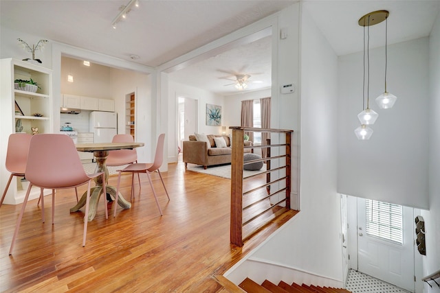 412 Merrill St, Houston, TX 77009 - dining room featuring light wood-type flooring and ceiling fan