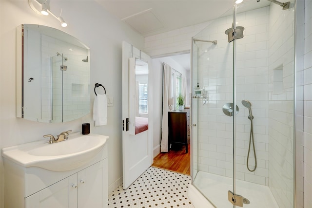 412 Merrill St, Houston, TX 77009 - bathroom featuring a stall shower, vanity, ensuite bath, and baseboards