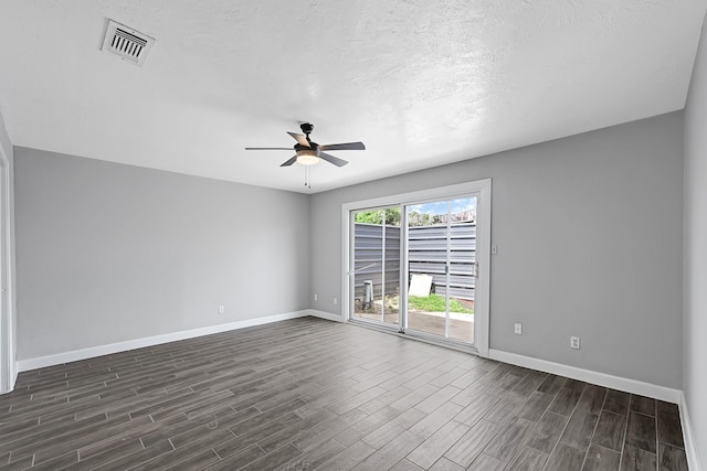 8910 Beau Monde Dr, Houston, TX 77099 - empty room with baseboards, ceiling fan, dark wood-style floors, and a textured ceiling
