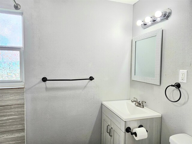 4606 Warren Way, Hitchcock, TX 77563 - half bath with healthy amount of natural light, toilet, and vanity