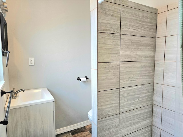 4606 Warren Way, Hitchcock, TX 77563 - bathroom with baseboards, vanity, and toilet