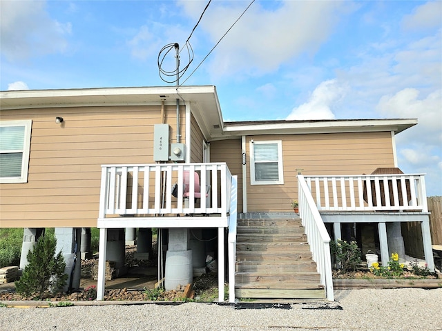 4606 Warren Way, Hitchcock, TX 77563 - rear view of house featuring stairway and a wooden deck