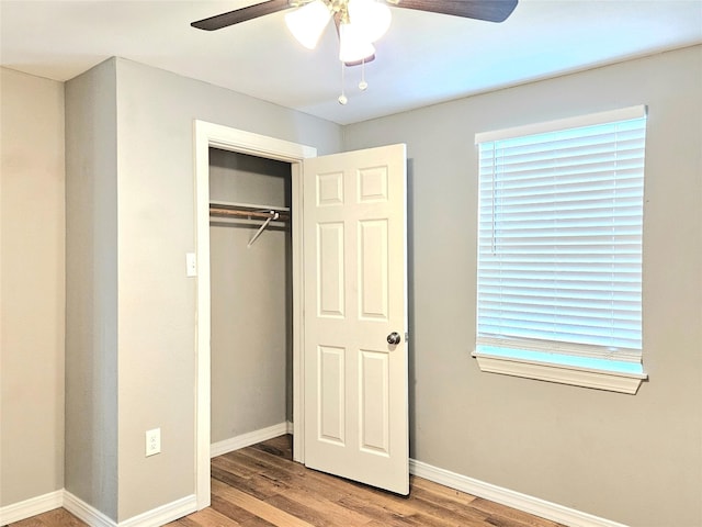 4606 Warren Way, Hitchcock, TX 77563 - unfurnished bedroom featuring wood finished floors, baseboards, a closet, and a ceiling fan