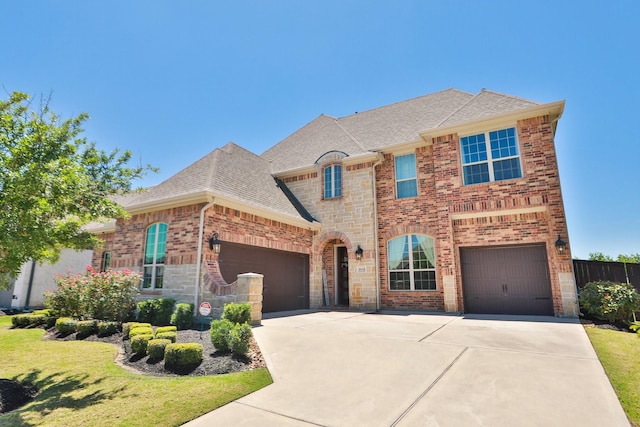 10134 Blythe St, Rosharon, TX 77583 - view of front of house with driveway, roof with shingles, and brick siding