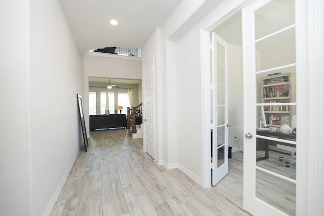 10134 Blythe St, Rosharon, TX 77583 - hall with french doors, wood finished floors, baseboards, and recessed lighting