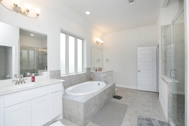 10134 Blythe St, Rosharon, TX 77583 - full bathroom with vanity, a shower stall, a garden tub, tile patterned floors, and recessed lighting