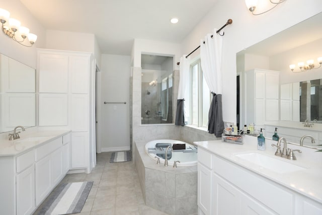 10134 Blythe St, Rosharon, TX 77583 - bathroom featuring two vanities, a bath, a tile shower, tile patterned flooring, and recessed lighting