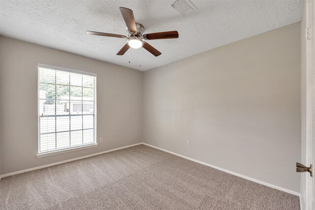 9507 Rannock Way, Spring, TX 77379 - carpeted spare room with a textured ceiling, baseboards, and ceiling fan