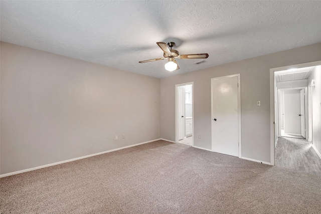 9507 Rannock Way, Spring, TX 77379 - unfurnished bedroom with attic access, carpet, baseboards, ensuite bath, and a textured ceiling