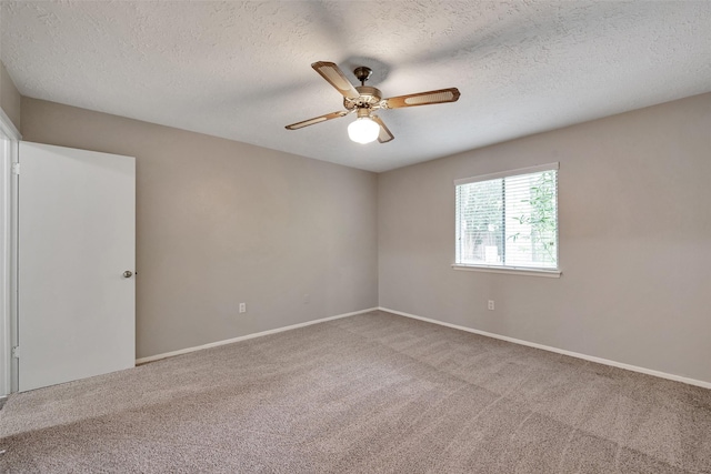 9507 Rannock Way, Spring, TX 77379 - empty room with carpet, a ceiling fan, a textured ceiling, and baseboards