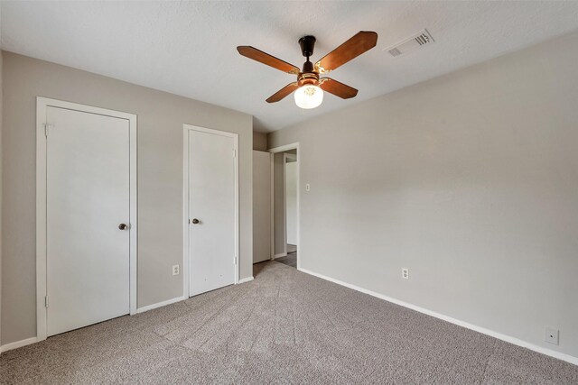 9507 Rannock Way, Spring, TX 77379 - unfurnished bedroom with carpet flooring, baseboards, two closets, and ceiling fan