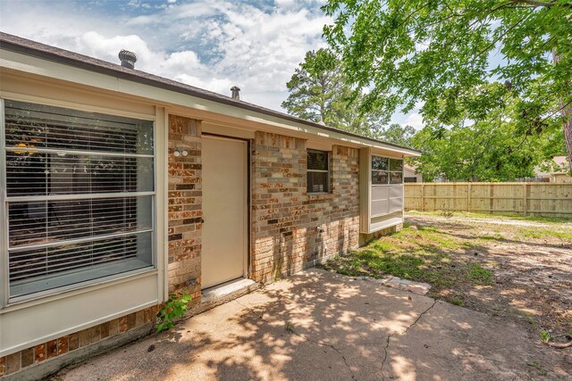 9507 Rannock Way, Spring, TX 77379 - entrance to property with a patio area, brick siding, and stone siding