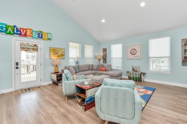 4019 Ector Dr, Galveston, TX 77554 - living room featuring light wood-type flooring, high vaulted ceiling, baseboards, and recessed lighting