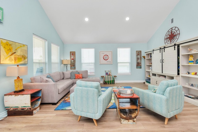 4019 Ector Dr, Galveston, TX 77554 - living area featuring wood finished floors, baseboards, recessed lighting, and high vaulted ceiling