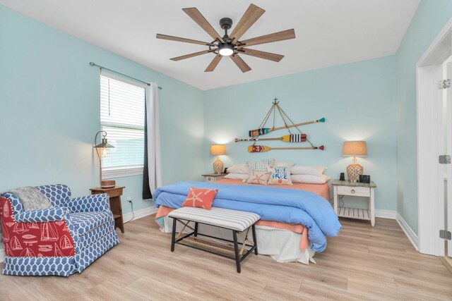 4019 Ector Dr, Galveston, TX 77554 - bedroom with wood finished floors, baseboards, and a ceiling fan