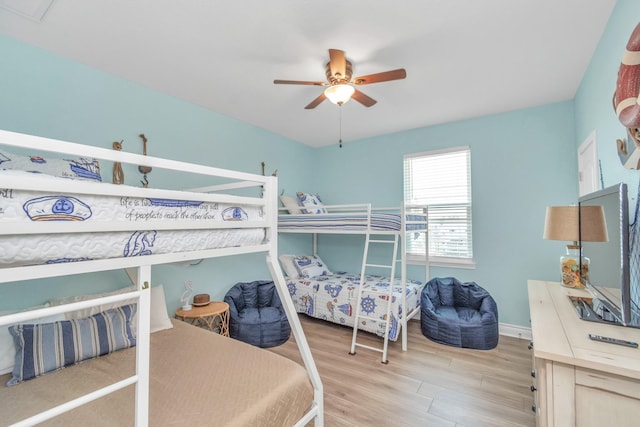4019 Ector Dr, Galveston, TX 77554 - bedroom featuring light wood-style flooring, baseboards, and ceiling fan