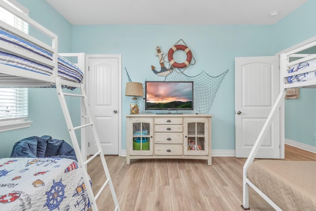 4019 Ector Dr, Galveston, TX 77554 - bedroom with light wood-style floors and baseboards