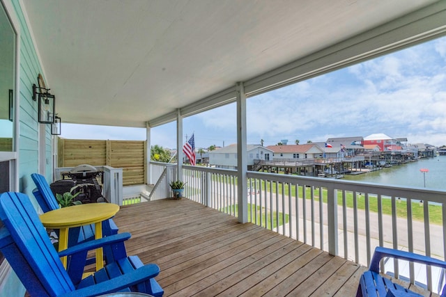 4019 Ector Dr, Galveston, TX 77554 - wooden terrace with a water view and a residential view