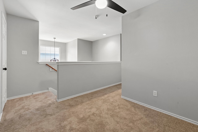 137 E Summerhaze Cir, The Woodlands, TX 77382 - spare room with ceiling fan, carpet floors, and baseboards