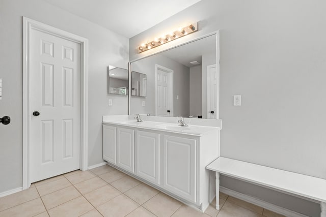 137 E Summerhaze Cir, The Woodlands, TX 77382 - bathroom with tile patterned floors, double vanity, and baseboards