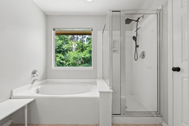 137 E Summerhaze Cir, The Woodlands, TX 77382 - full bathroom featuring a stall shower, a garden tub, and tile patterned flooring
