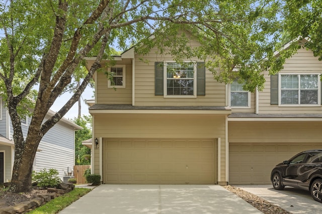 137 E Summerhaze Cir, The Woodlands, TX 77382 - view of front facade with concrete driveway and a garage