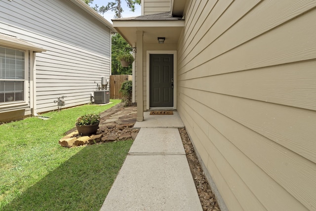 137 E Summerhaze Cir, The Woodlands, TX 77382 - doorway to property featuring central AC unit