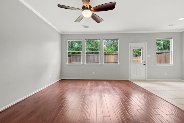 137 E Summerhaze Cir, The Woodlands, TX 77382 - unfurnished room featuring ornamental molding, ceiling fan, wood finished floors, and baseboards